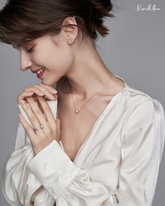 Lady wearing pearl earrings and single akoya pearl necklace and pearl ring