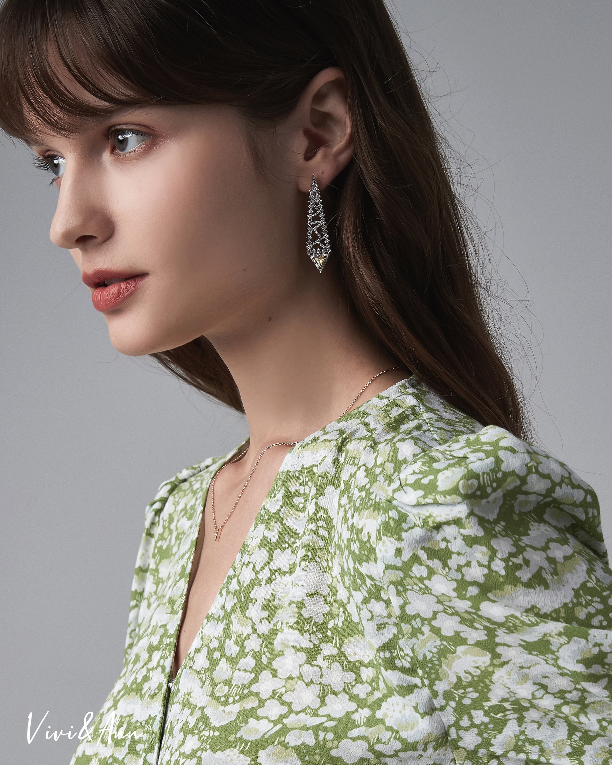 Lady wearing yellow diamond earring
