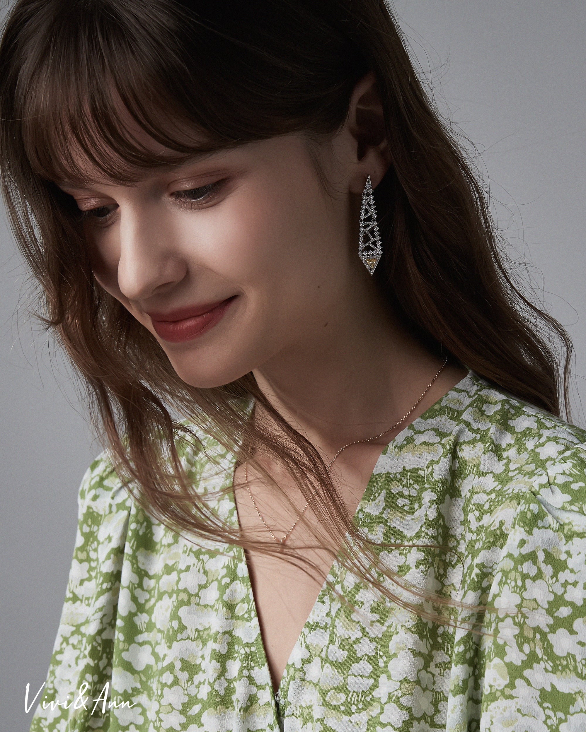 Lady wearing yellow diamond earring