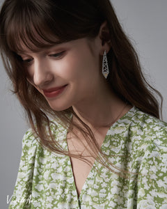 Lady wearing yellow diamond earring