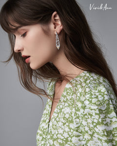 Lady wearing yellow diamond earring