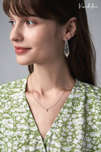 Lady wearing yellow diamond earring