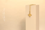Load image into Gallery viewer, Yellow gold heart-shape coin necklace on a white object
