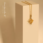 Load image into Gallery viewer, Yellow gold heart-shape coin necklace on a white object
